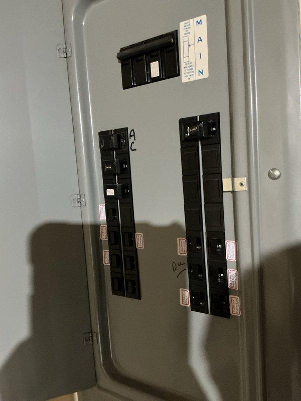 Conducted site assessment for electric vehicle charging station installation requiring power distribution from basement electrical panel to main floor garage. Evaluated existing electrical infrastructure, including main service panel capacity and circuit breaker configuration, to determine feasibility of adding dedicated EV charger circuit. Documented current panel layout and available breaker spaces to develop comprehensive quote for running new electrical service between floors.