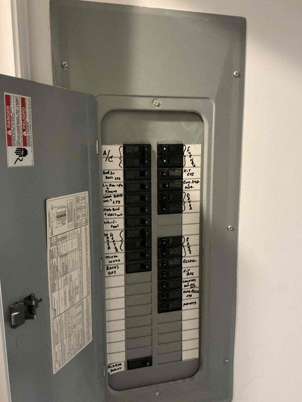 Responded to reported non-functional crystal chandelier and inoperative light switch on first floor, along with a separate lighting issue on the second floor. Performed electrical troubleshooting at the main breaker panel to identify circuit assignments and verified proper breaker operation for affected areas. Inspected the multi-tier chandelier fixture with candle-style lamps, tested switching circuits, and restored power to all reported lighting fixtures.