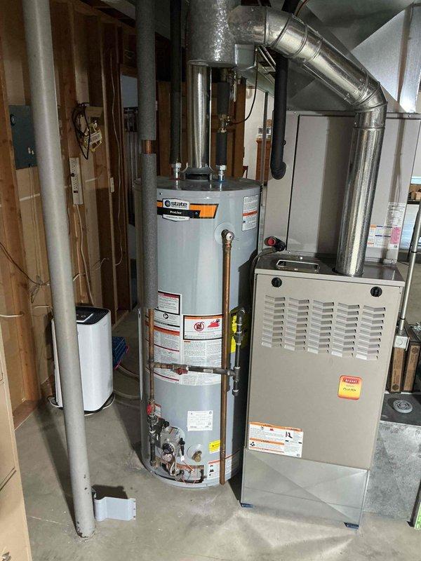 Installed 50-gallon gas tall water heater in basement to resolve no hot water condition. Connected all water supply lines, gas piping, and venting per code requirements under permit #26PLU-13661. Applied required plumbing identification sticker and verified proper operation of new Bradford White unit with extended warranty coverage.