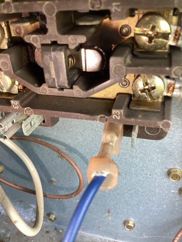 Responded to service call for cooling system blowing warm air on unit over 10 years old located in side yard. Upon inspection, found failed contactor preventing compressor operation. Removed defective contactor from unit, installed replacement contactor, verified all electrical connections at terminal block were secure, and tested system operation. Unit now cooling properly with compressor engaging as designed.