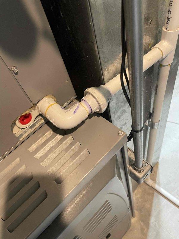 Responded to service call for water leak on 5-year-old Armstrong air conditioning system. Upon inspection, identified condensate drain line issue at the air handler unit. Cleared blockage in drain line, verified proper drainage flow through PVC condensate piping system, and tested all connections for leaks. Confirmed air handler is operating correctly with no further water discharge issues. System returned to normal operation with proper condensate removal functioning as designed.
