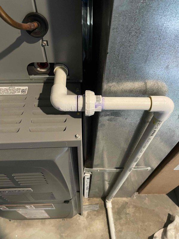 Responded to service call for water leak on 5-year-old Armstrong air conditioning system. Upon inspection, identified condensate drain line issue at the air handler unit. Cleared blockage in drain line, verified proper drainage flow through PVC condensate piping system, and tested all connections for leaks. Confirmed air handler is operating correctly with no further water discharge issues. System returned to normal operation with proper condensate removal functioning as designed.