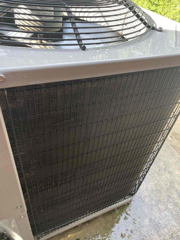 Completed comprehensive tune-up on single ground-level AC unit per Home Depot work order. Performed standard maintenance protocol including inspection of condenser unit, coils, and fan assembly. Evaluated and replaced 20x25x1 air filter which showed moderate dust accumulation. Unit exterior displayed normal weathering with surface dirt on casing and fan guard; condensate drainage observed on concrete pad with minor algae growth present. All components functioning within normal parameters upon completion of tune-up service.
