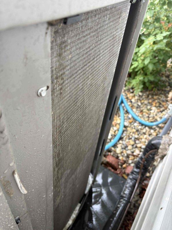 Responded to customer complaint of AC unit making repeated "revving up" noises in a cycling pattern while still maintaining cooling capacity. Upon inspection of 2-year-old Lennox system, found outdoor condenser unit's intake grille and filter heavily restricted with dust, dirt, and debris accumulation. Restricted airflow was causing compressor to cycle on high-pressure cutout as unit struggled to maintain adequate heat exchange. Removed and cleaned condenser filter, cleared debris from intake grille mesh screening. Verified proper airflow restoration through condenser coil. Cycled unit through multiple cooling cycles to confirm elimination of abnormal sound patterns and return to normal operating parameters.