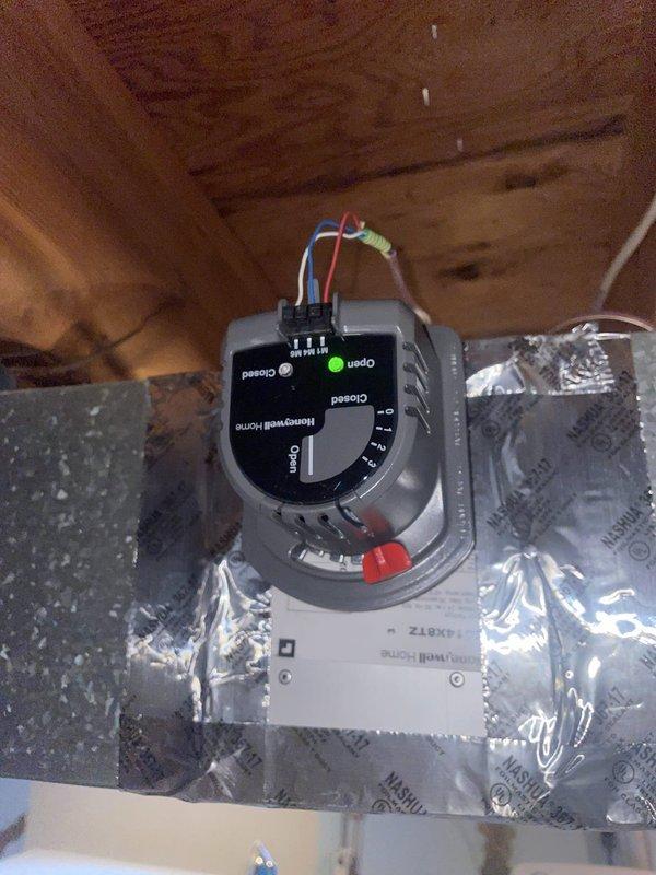 Responded to service call for sound complaint and dehumidification malfunction on recently installed S40 system. Inspected Honeywell zone control damper in attic space and verified proper wiring connections and operational status of zone controller. Evaluated system operation, identified issue with dehumidification settings, and adjusted controls to resolve performance concerns. Verified garage door opener interference was not affecting HVAC operation. System tested and confirmed operating within normal parameters with proper dehumidification function restored.