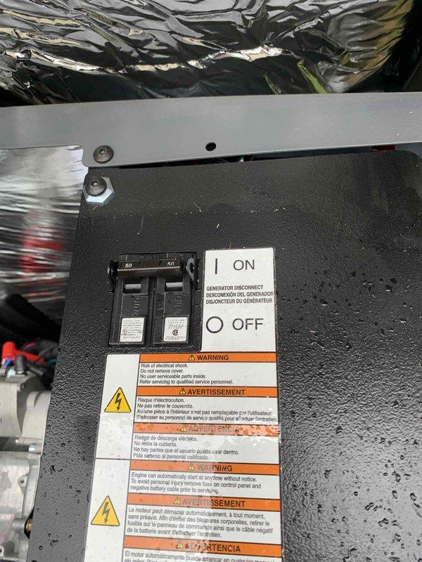 Responded to service call for standby generator that was running test cycles but not producing power output. Upon arrival, inspected the backyard-mounted generator system and associated transfer switch panel. Performed diagnostic testing using clamp meter to verify absence of power generation during simulated test cycle. Identified issue with generator control panel and transfer switch operation preventing power transfer to the electrical distribution system despite engine operation. Inspected circuit breakers, bus bar connections, and generator disconnect switch for proper operation and secure connections. Documented existing conditions of electrical panel components including 50-amp and 60-amp breakers, control wiring, and safety disconnect mechanisms. Reviewed warning labels and confirmed proper safety protocols. Provided assessment of necessary repairs to restore full generator functionality and power transfer capability.