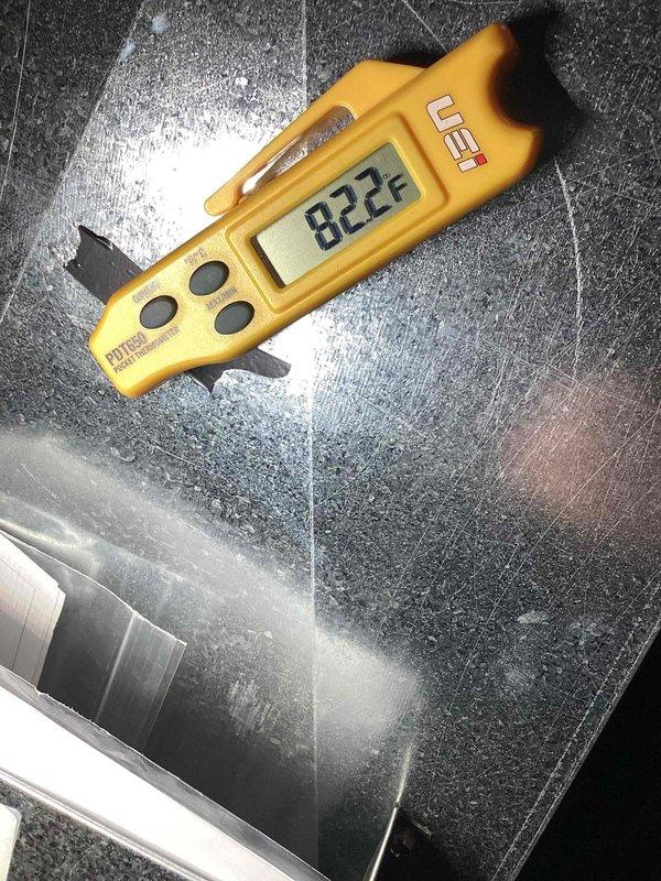 Responded to service call for frozen evaporator coil. Upon arrival, confirmed ice accumulation on coil surface with temperature readings of 82.2°F on affected components. Initial diagnosis performed; will require follow-up visit to complete troubleshooting and determine root cause of freezing condition, which may include low refrigerant charge, airflow restriction, or system malfunction. Refrigerant scale positioned on-site for charging operations during return visit.