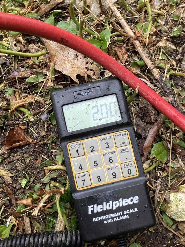 Responded to service call for frozen evaporator coil. Upon arrival, confirmed ice accumulation on coil surface with temperature readings of 82.2°F on affected components. Initial diagnosis performed; will require follow-up visit to complete troubleshooting and determine root cause of freezing condition, which may include low refrigerant charge, airflow restriction, or system malfunction. Refrigerant scale positioned on-site for charging operations during return visit.