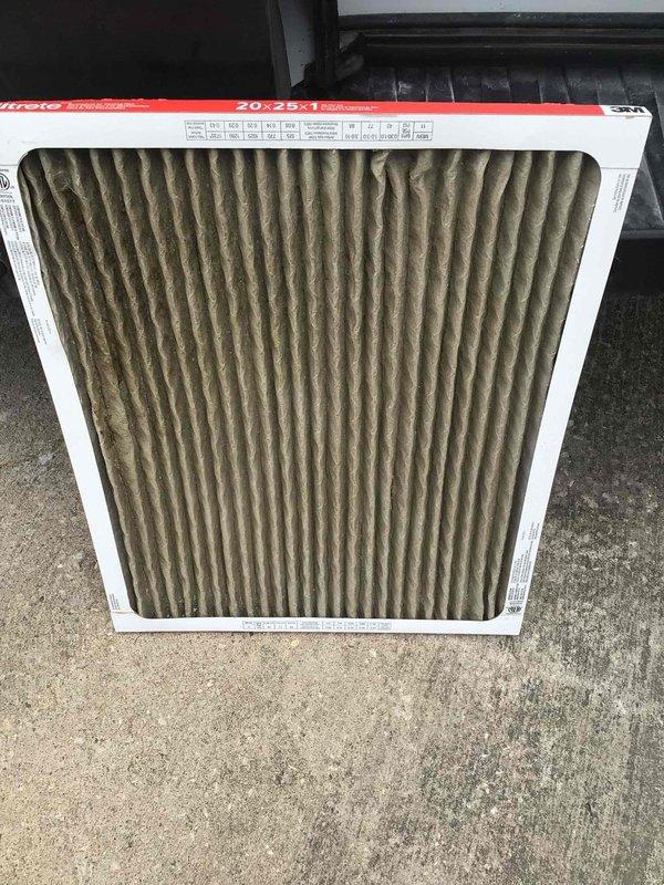 # HVAC Service Report - No Cool Issue Resolved

Responded to service call for air conditioning system not maintaining temperature at end of day with error code displayed on thermostat panel. Arrived on-site after 2 PM per customer request and began diagnostic evaluation of cooling system performance.

Upon initial inspection, discovered system was running continuously but failing to achieve desired setpoint temperatures throughout residence. Retrieved error code from thermostat display and cross-referenced with manufacturer diagnostic codes to identify potential failure points.

Proceeded with systematic evaluation of air conditioning components, beginning with airflow assessment. Located return air filter and found it severely restricted with heavy accumulation of dust, dirt, and debris throughout the pleated media. Filter showed significant darkening and contamination across entire surface area, indicating extended service interval without replacement. The 20×25×1 filter was complete