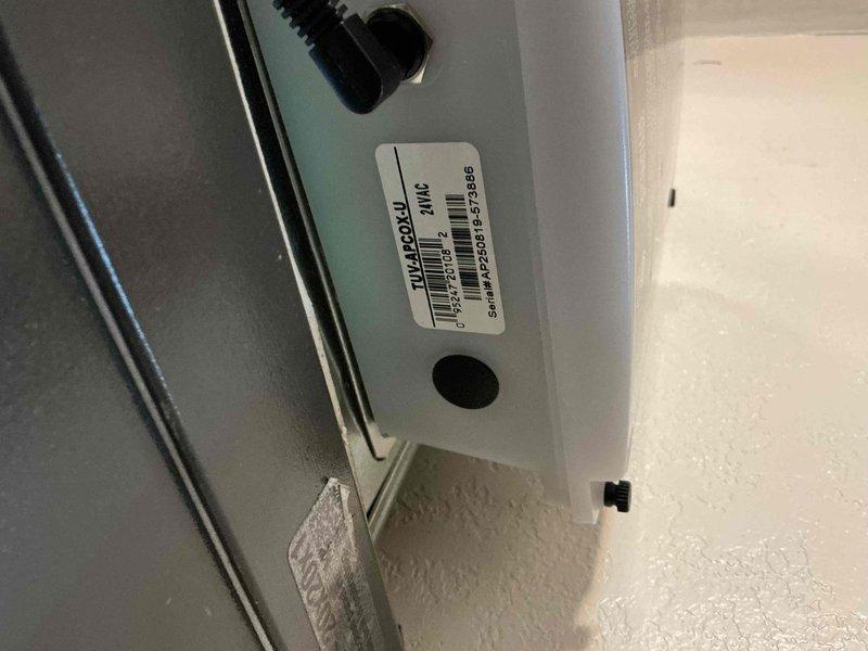 Responded to service call for non-operational whole-house UV air purification system. Upon arrival, inspected UV unit mounted to HVAC ductwork and accessed control panel to diagnose issue. Found UV system control module and wiring connections; verified power supply and checked electrical connections within junction box. Documented equipment configuration including UV lamp housing mounted to supply duct adjacent to Lennox HVAC unit. System evaluated and photographed for service records.