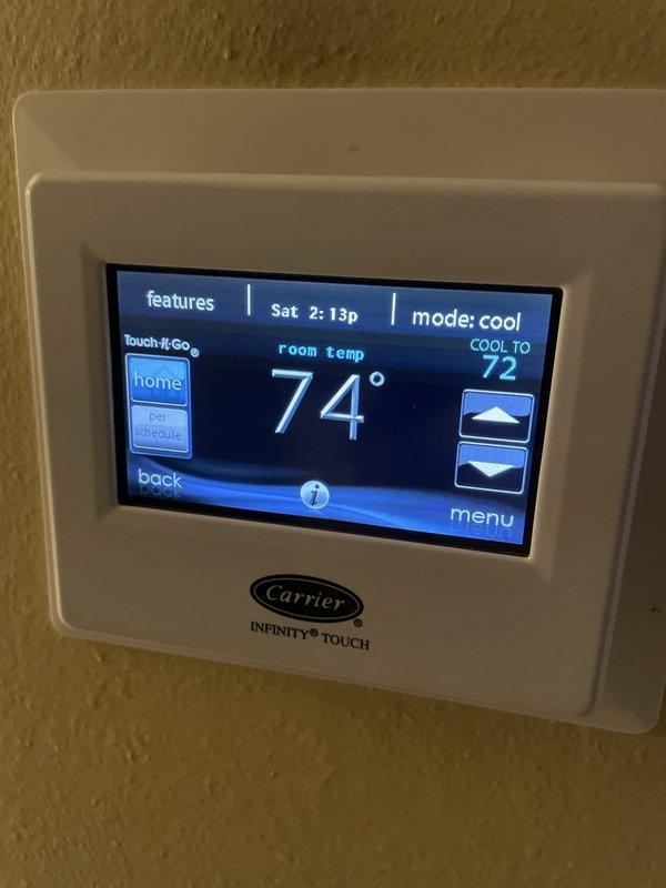 Responded to no cooling call on 10+ year old Carrier system with Infinity Touch thermostat displaying error code 196 (auxiliary input G shutdown fault). Diagnosed intermittent system cycling issue caused by faulty auxiliary input signal triggering safety shutdown. Cleared fault code, tested system operation through multiple cooling cycles, and verified proper communication between thermostat and air handler to restore normal cooling function.