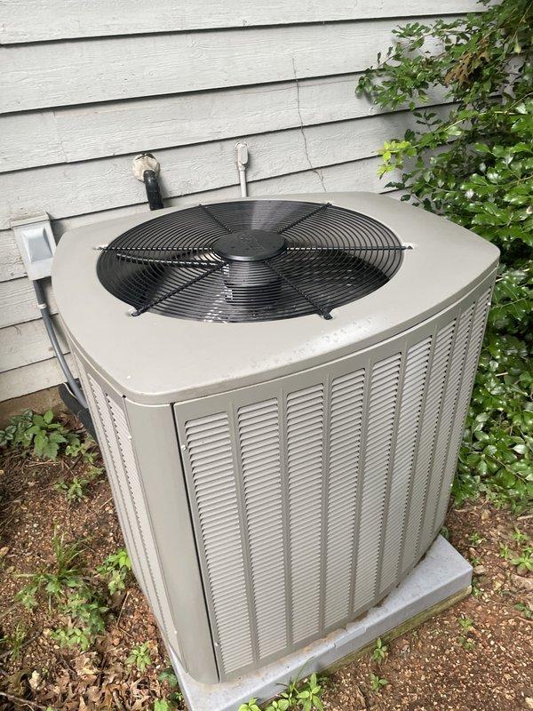 Responded to no-cool call following storm on recently installed residential air conditioning system (under 1 year old). Upon arrival, inspected outdoor condenser unit located in side yard and found equipment physically intact with no visible storm damage to cabinet, fan assembly, or electrical components. Verified unit was attempting to cycle on as reported. Checked indoor air handler and inspected air filter, which showed normal dust accumulation for age of system. Advised customer to turn unit off and leave fan running to prevent potential compressor damage while system was evaluated. Photographed outdoor unit showing proper installation on concrete pad with adequate clearance and documented indoor filter condition. Unit power cycled successfully with no immediate fault codes detected. System appeared to recover normal operation following storm-related power interruption.