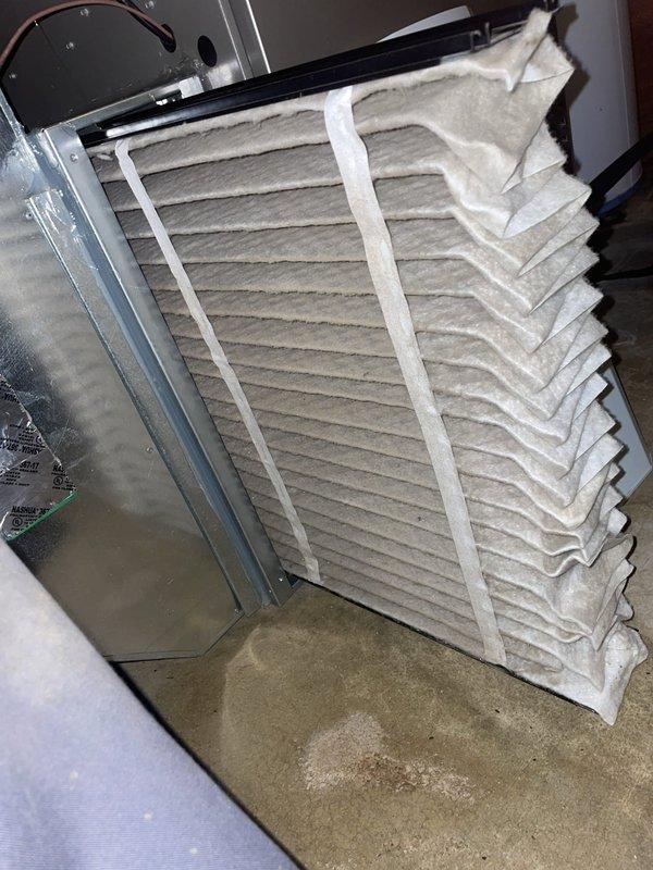 Responded to no-cool call following storm on recently installed residential air conditioning system (under 1 year old). Upon arrival, inspected outdoor condenser unit located in side yard and found equipment physically intact with no visible storm damage to cabinet, fan assembly, or electrical components. Verified unit was attempting to cycle on as reported. Checked indoor air handler and inspected air filter, which showed normal dust accumulation for age of system. Advised customer to turn unit off and leave fan running to prevent potential compressor damage while system was evaluated. Photographed outdoor unit showing proper installation on concrete pad with adequate clearance and documented indoor filter condition. Unit power cycled successfully with no immediate fault codes detected. System appeared to recover normal operation following storm-related power interruption.