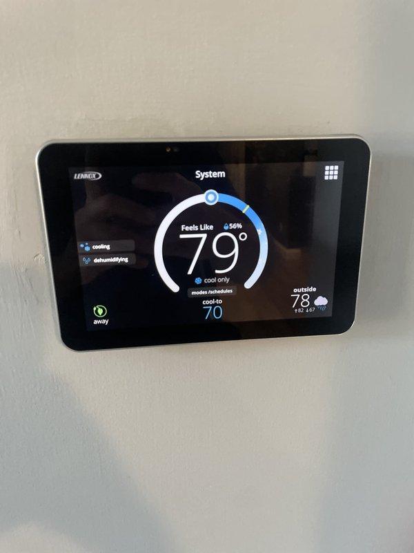 Responded to no cooling call following power outage with thermostat displaying "system under test" message. Upon arrival, inspected electrical panel and found HVAC circuit breaker tripped. Reset breaker at main panel and verified proper power restoration to condensing unit in side yard. Cycled system through complete cooling operation, confirmed compressor engagement, and verified thermostat communication with equipment. System restored to normal cooling function with setpoint achieved.