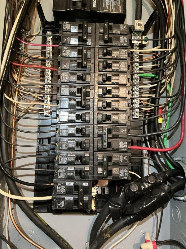 Completed comprehensive electrical panel assessment and provided detailed estimate for full panel replacement. Evaluated existing residential electrical distribution system with exposed interior components, documented current circuit breaker configuration, wire routing, and main service entry conductors. Assessed wall penetration and conduit routing requirements for new panel installation, including necessary drywall repair and finish work to restore interior wall surfaces following electrical upgrade completion.