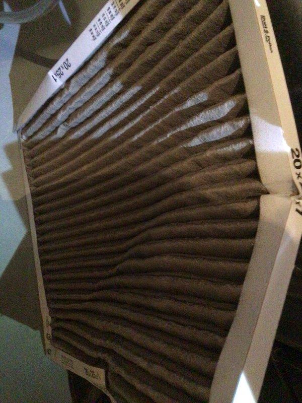 Responded to report of knocking noise from outdoor AC unit. Upon inspection, found condenser unit operational with accessible exterior-mounted components showing age-related oxidation on refrigerant lines. Identified heavily soiled air filter as contributing factor to system stress. Replaced dirty pleated filter and inspected copper refrigerant piping connections for secure mounting to eliminate potential noise source from loose components or vibration against mounting surface.
