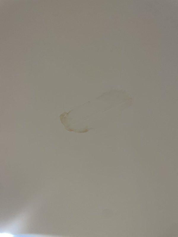 Responded to call for clogged condensation drain on basement HVAC unit under 10 years old. Upon arrival, discovered significant water damage to ceiling caused by condensate drain line blockage, evidenced by brown water staining and deteriorated drywall with exposed substrate. Cleared obstruction from condensate drain line and verified proper drainage flow. Tested system operation to confirm condensate is now draining correctly and no further overflow occurring.