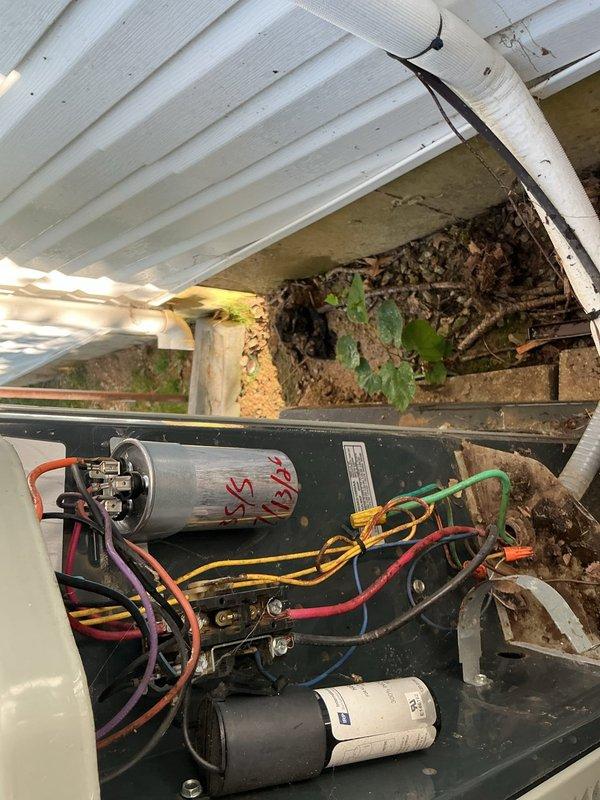 Responded to no cooling complaint on 10+ year old ground-level outdoor unit. Upon arrival, performed diagnostic testing and discovered failed dual-run capacitor preventing compressor and condenser fan operation. Replaced defective capacitor with manufacturer-specified component, restored power, and verified proper amperage draws and system pressures using calibrated gauges. Unit returned to normal cooling operation with all components functioning within specifications.