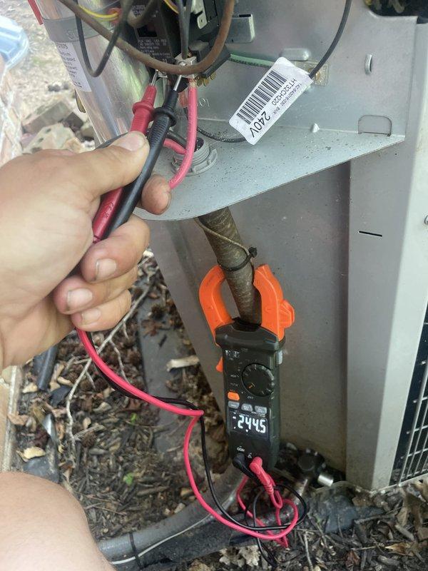 Responded to callback for repeatedly tripped breaker causing system shutdown and elevated indoor temperature. Performed electrical diagnostics on outdoor unit using digital multimeter and clamp meter. Measured supply voltage at 244.5V and operating amperage at 13.09A. Inspected all wire connections, terminals, and internal electrical components within the condenser cabinet. Tested motor assembly and control circuits to identify source of overcurrent condition causing breaker trips. System operational at time of service with readings within normal parameters.