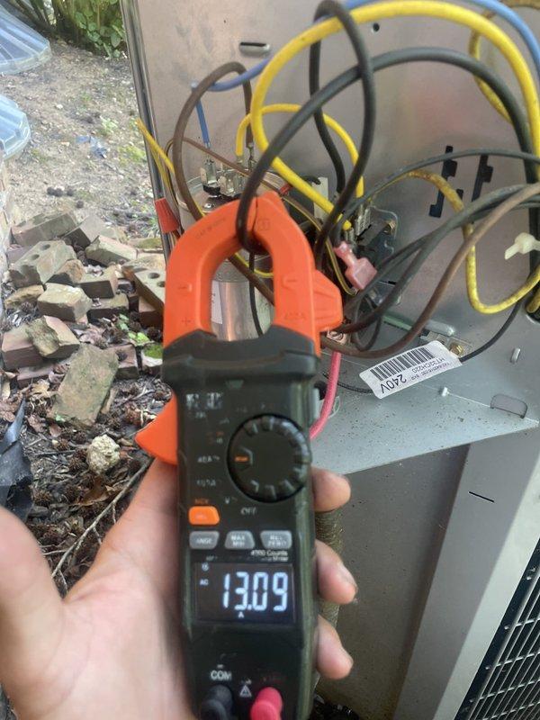 Responded to callback for repeatedly tripped breaker causing system shutdown and elevated indoor temperature. Performed electrical diagnostics on outdoor unit using digital multimeter and clamp meter. Measured supply voltage at 244.5V and operating amperage at 13.09A. Inspected all wire connections, terminals, and internal electrical components within the condenser cabinet. Tested motor assembly and control circuits to identify source of overcurrent condition causing breaker trips. System operational at time of service with readings within normal parameters.