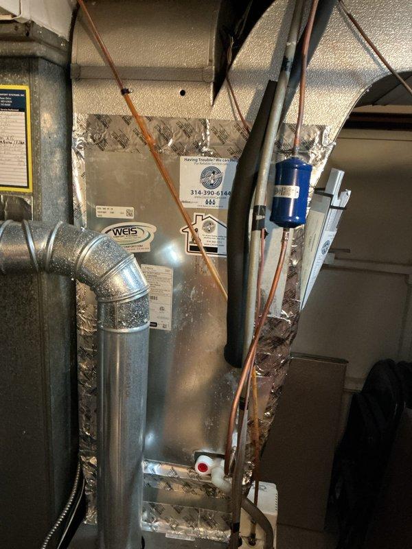 Replaced defective evaporator coil under warranty on residential HVAC system. Removed old coil, installed new unit, reconnected refrigerant lines and ductwork, and verified proper system operation. System restored to full heating and cooling functionality with all components tested and confirmed operational.