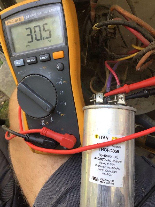 Completed comprehensive cooling tune-up service on two 10-year-old outdoor AC units located on side of property. Performed standard maintenance protocol including filter inspection, electrical testing with Fluke multimeter, and capacitor diagnostics on Titan TRCFD355 dual-run capacitor (35+5 MFD, 440/370VAC). Both systems operational and running within manufacturer specifications upon completion.