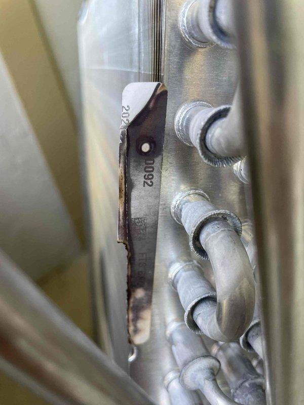 Installed new evaporator coil and thermostatic expansion valve (TXV) on HVAC unit serial number 2208467529. Previous TXV installation from April was incorrect and required replacement. Both components were successfully installed and system restored to proper operation.