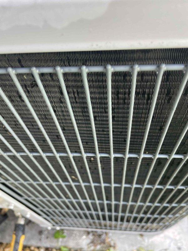 Completed comprehensive cooling system tune-up on single ground-level AC unit. Performed standard maintenance protocol including inspection of blower assembly, motor operation, and electrical connections; verified proper function of squirrel-cage blower fan; cleaned condenser coil fins and checked refrigerant lines for proper insulation and connections. All components found operating within normal parameters with typical dust accumulation addressed during service.