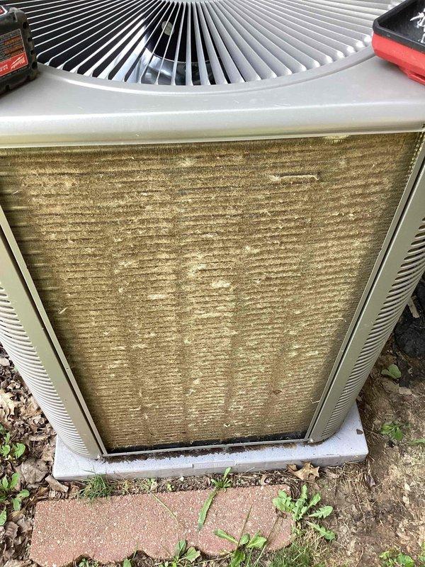 Responded to service call for cooling system not maintaining set temperature on residential unit less than 10 years old located in side yard. Upon arrival, observed outdoor condensing unit with heavy dirt and debris accumulation on exterior panels and surrounding area, indicating extended period without maintenance. Performed diagnostic temperature measurements on unit components using digital thermometer. Found unit operating but compromised by restricted airflow due to excessive dirt buildup on coils and cabinet surfaces. Documented equipment condition with photos showing contaminated exterior surfaces and diagnostic readings. Unit was previously advised to be shut off prior to service visit. Recommended thorough coil cleaning and system evaluation to restore proper cooling capacity and airflow efficiency.