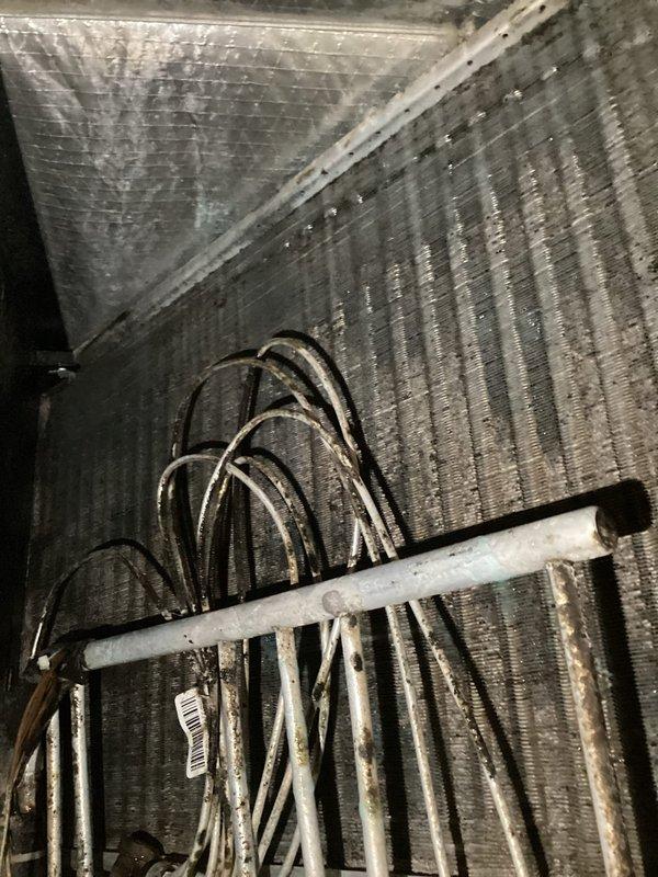 Responded to callback for water leakage from air handler in utility closet following previous service visit. Upon arrival, inspected HVAC unit and identified condensate drainage issue. Found condensate drain line improperly pitched, causing water to back up and overflow from drain pan. Corrected drain line slope to ensure proper gravity flow, cleared any blockages, and verified condensate removal system functioning correctly. Inspected evaporator coil and drain pan for proper seating and confirmed no cracks or damage present. Tested unit operation through complete cooling cycle and verified no water leakage occurring. System operating within normal parameters with no further issues detected.