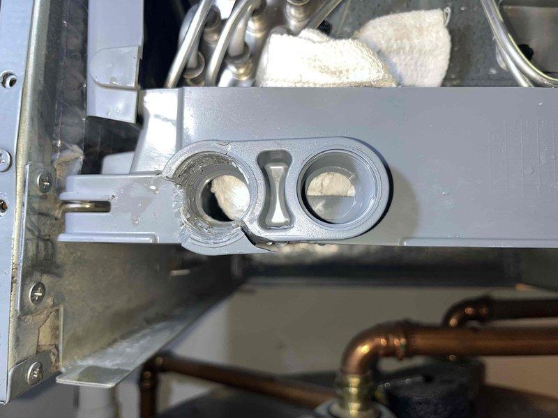 Returned to property to reinstall evaporator coil assembly after previous installation resulted in cross-threaded drain pan connection that caused damage to the original coil. Removed damaged coil from system and discarded per protocol since warranty could not be processed due to installation damage. Installed replacement evaporator coil obtained from supply house, ensuring proper alignment and secure connection of drain pan to prevent threading issues. Connected refrigerant lines to new coil assembly with proper torque specifications and verified all brass fittings were secure. Tested system operation to confirm heating and cooling functionality restored. Unit operational upon departure.