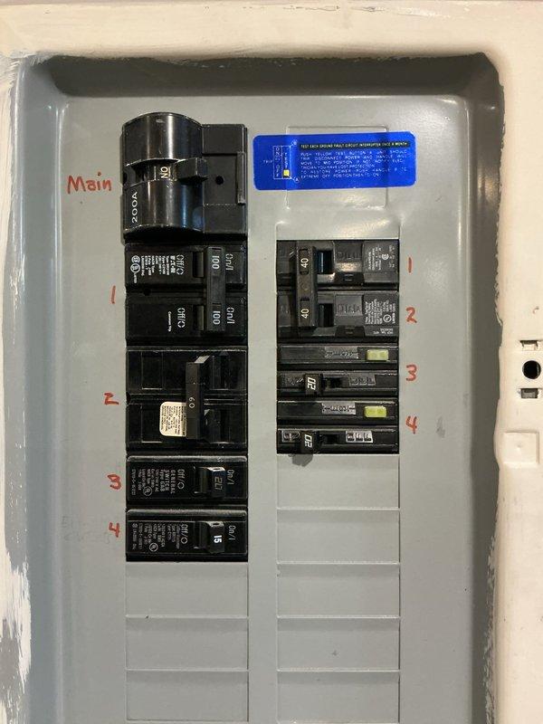 Completed electrical estimate for Generac generator installation. Evaluated existing electrical panel configuration, including main breaker assembly and circuit breaker layout with numbered positions across two columns. Assessed current electrical infrastructure and plumbing manifold system in utility area to determine optimal integration points for generator connection. Documented site conditions and captured detailed photographs of electrical panel and mechanical systems for comprehensive proposal development.