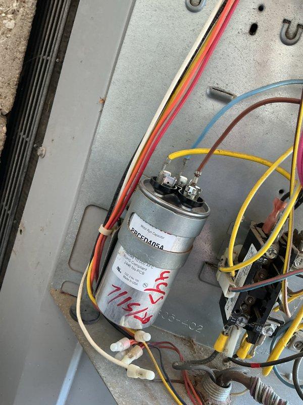 Responded to no cooling complaint on 3-year-old residential air conditioning system. Upon inspection, diagnosed failed run capacitor with visible degradation and incorrect microfarad reading of 7μF. Replaced defective capacitor with proper OEM specification unit, restored all electrical connections, and verified system operation. Measured supply air temperature at 88.5°F prior to repair; confirmed adequate cooling performance and proper amperage draw after capacitor replacement.