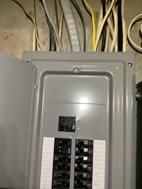 Responded to warranty callback for electrical panel installed in February with reported red indicator lights flashing and non-functional garage lighting. Upon inspection, identified fault condition in control module causing status indicators to illuminate and interrupting power to garage circuit. Reset affected breakers, verified proper voltage at panel terminals, and confirmed all circuits restored to normal operation with garage lights functioning correctly.
