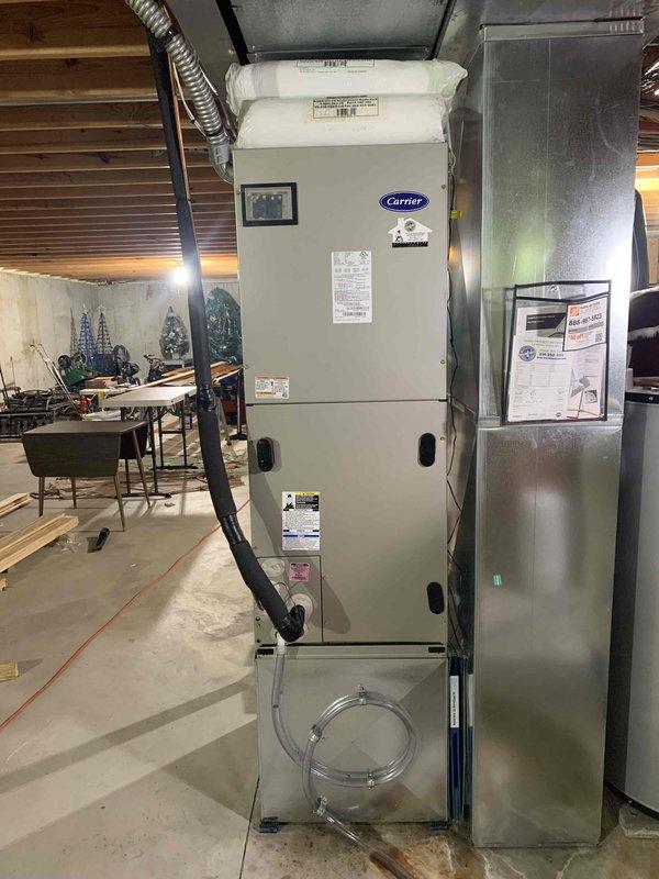 Replaced evaporator coil in Carrier air handler unit (serial number 2616a84870) located in basement installation. Installed new filter drier as part of the coil replacement procedure. System tested and confirmed operational for cooling mode following completion of warranty repair work.