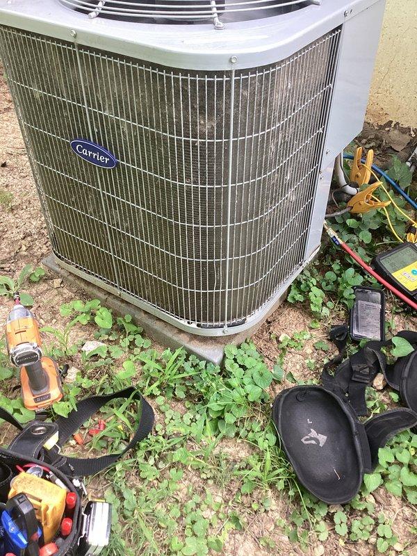 Responded to no-cooling complaint on Carrier outdoor condensing unit. Upon arrival, found evaporator coil with moderate dust and debris accumulation restricting airflow, and outdoor condenser coil heavily soiled with dirt, vegetation matter, and environmental debris causing reduced heat transfer efficiency. Performed thorough coil cleaning on both evaporator and condenser coils using appropriate cleaning solutions and equipment. Cleared debris from around unit base and restored proper airflow. System tested after service and confirmed adequate cooling operation restored.