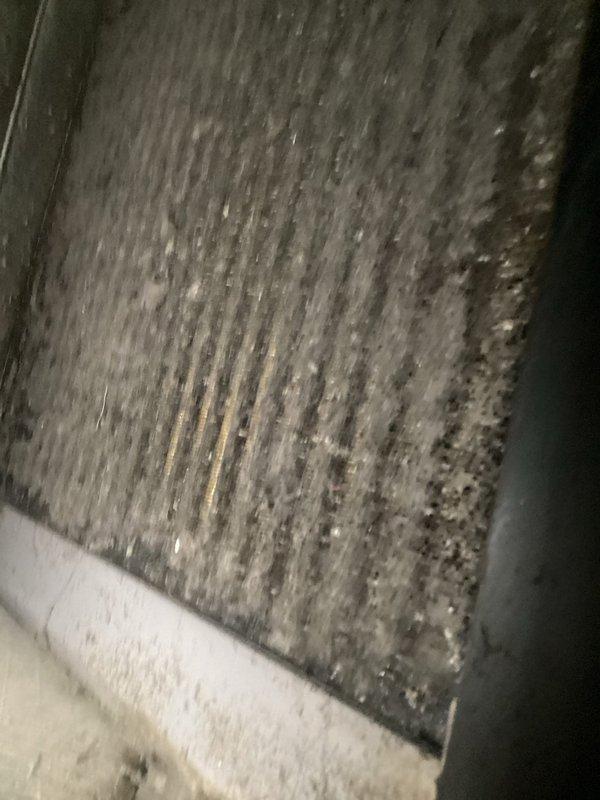 Responded to no-cooling complaint on Carrier outdoor condensing unit. Upon arrival, found evaporator coil with moderate dust and debris accumulation restricting airflow, and outdoor condenser coil heavily soiled with dirt, vegetation matter, and environmental debris causing reduced heat transfer efficiency. Performed thorough coil cleaning on both evaporator and condenser coils using appropriate cleaning solutions and equipment. Cleared debris from around unit base and restored proper airflow. System tested after service and confirmed adequate cooling operation restored.