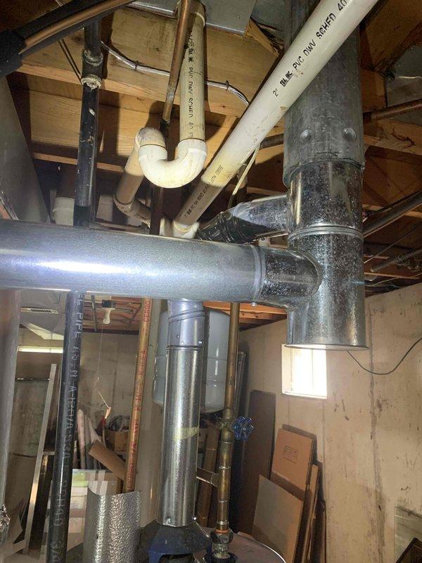 Installed a new 40-gallon tall gas water heater in basement location, replacing existing 10-year-old unit. Completed all gas line connections, water supply piping, and venting per code requirements under permit #26PLU-14245. Applied required plumbing identification sticker and verified proper operation of all safety controls upon startup.