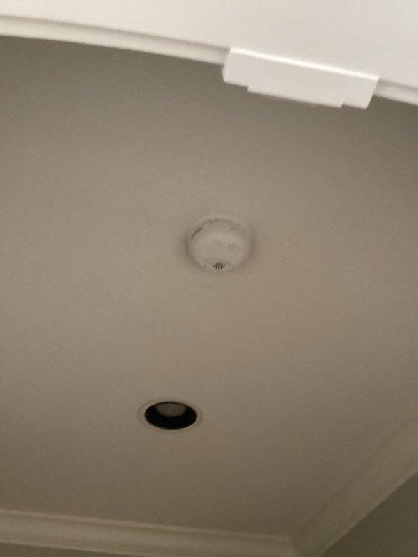 Completed installation of smoke detectors in residential property. Mounted two circular smoke alarm units to ceiling surfaces, ensuring proper placement and secure attachment in accordance with local fire safety codes. All devices tested and confirmed operational upon completion.