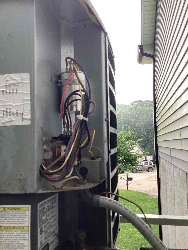 Responded to no cooling complaint on outdoor condensing unit U10 located on elevated side of house requiring ladder access. Upon arrival, performed system diagnostics on both indoor air handler and outdoor condensing unit. Removed access panel on outdoor unit to inspect electrical components and wiring connections. Found internal electrical wiring and control circuits accessible for thorough inspection. Evaluated compressor contactor, capacitor connections, and control board terminals. Checked refrigerant line connections and verified proper electrical supply to unit. Documented system conditions with interior air handler equipment and outdoor unit electrical compartment for customer records and repair recommendations.