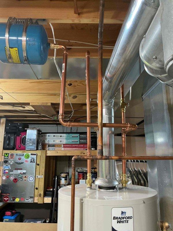 Replaced existing State brand water heater with new 50-gallon tall gas Bradford White unit in accordance with specifications. Installed new copper supply lines, brass fittings, and proper venting connections to ensure code-compliant operation. Verified all connections for proper operation and leak-free performance upon completion.