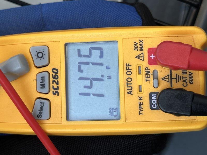 Responded to no cooling complaint on 2-year-old Goodman residential air conditioning system affecting entire home. Upon arrival, performed diagnostic assessment using digital multimeter to measure system temperatures and verify operational parameters. Inspected and evaluated air filter condition, which showed moderate dust accumulation in the pleated media. Checked system electrical readings and confirmed proper voltage supply. Measured supply air temperature at 51.15°F, indicating system was producing cool air at time of inspection. Verified airflow through filter housing and return air pathway. System found to be operating within normal parameters during service call. Documented findings with photos of diagnostic equipment readings and filter condition for service records.