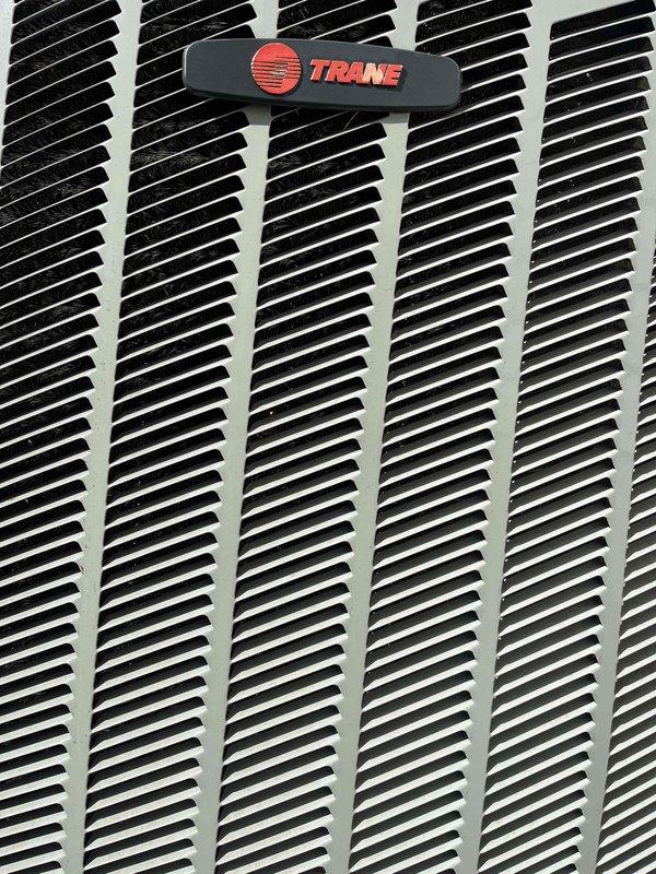 Completed cooling system tune-up on single Trane AC unit located on side of home. Performed comprehensive maintenance inspection, checked refrigerant levels, cleaned condenser coils, verified electrical connections, and tested system operation. Unit filter inspected and found in acceptable condition with minimal dust accumulation; all components functioning properly with no issues identified.