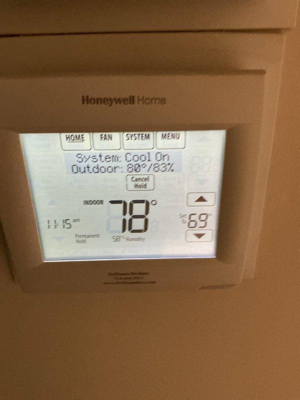 Responded to callback for air conditioning system not operating following recent repairs. Upon arrival, verified thermostat was calling for cooling with system status showing "Cool On" and setpoint at 69°F while indoor temperature read 78°F. Diagnosed refrigerant charge issue related to previous service work. Utilized recovery cylinder and digital scale to accurately measure and adjust refrigerant levels to manufacturer specifications. System tested and confirmed operational with proper cooling cycle established.