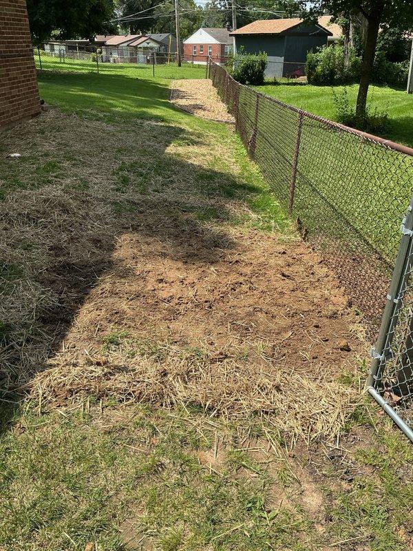Responded to callback for settling yard concerns along fence line. Upon arrival, inspected area where ground had settled near plumbing installation site. Raked and redistributed displaced soil and mulch material along fence perimeter to level surface and restore proper grade. Documented site conditions with photographs showing completed restoration work.