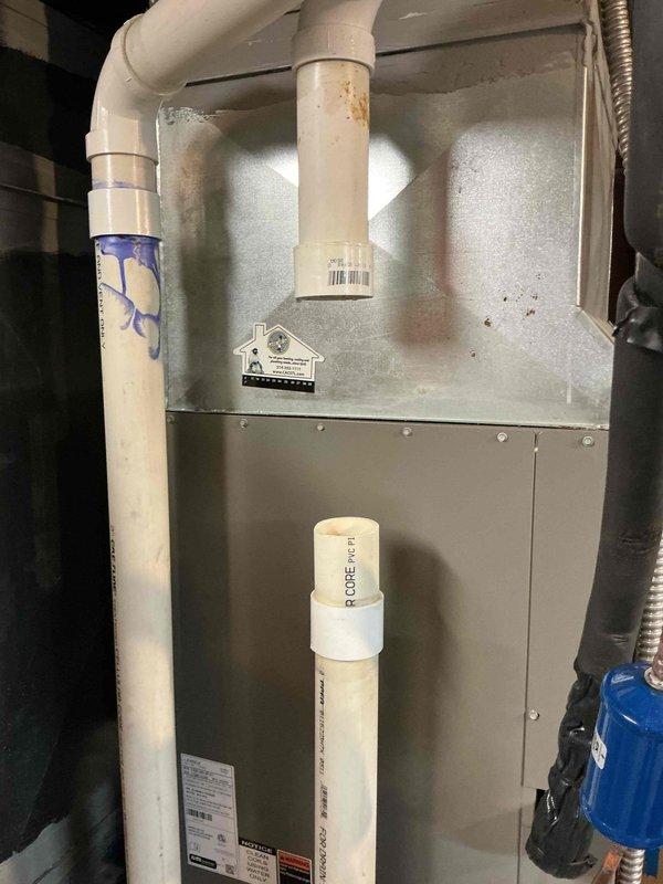 Returned to property to complete PVC condensate drain repair on furnace system. Installed two 2-inch PVC couplings and one foot of 2-inch PVC pipe to properly reconnect and secure the condensate drainage lines. System tested and confirmed operational with proper drainage flow restored.
