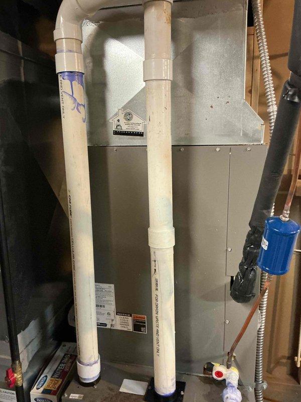 Returned to property to complete PVC condensate drain repair on furnace system. Installed two 2-inch PVC couplings and one foot of 2-inch PVC pipe to properly reconnect and secure the condensate drainage lines. System tested and confirmed operational with proper drainage flow restored.
