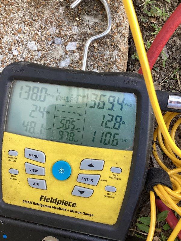 Responded to service call for air conditioning unit leaking water inside wall of mobile home in hallway area. Upon arrival, performed diagnostic testing using refrigerant manifold gauge to assess system pressures and temperatures. Pressure readings indicated abnormal subcooling levels, suggesting potential refrigerant flow or evaporator coil issues contributing to excessive condensation and water leakage. Inspected outdoor condensing unit and verified equipment operation, checking for proper drainage and identifying source of water intrusion into interior wall cavity.