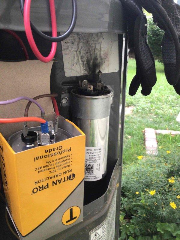 Responded to no cooling complaint on 5-year-old ground-level unit. Upon inspection, found failed run capacitor with severe heat damage, visible burn marks, and charred terminal connections affecting compressor operation. Replaced damaged capacitor, verified proper electrical connections, and restored system to normal cooling operation.
