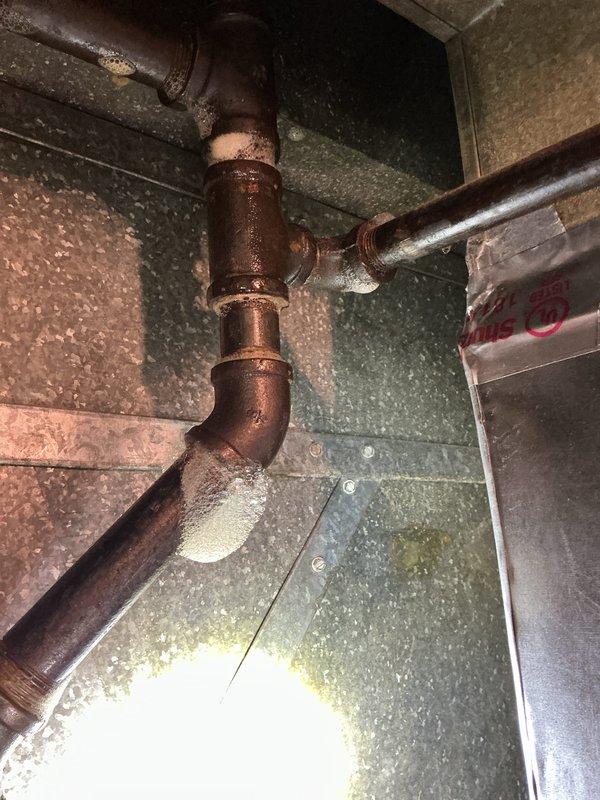 Responded to emergency service call at 60-year-old residence where carbon monoxide detector alarm led to discovery of main gas line leak. Utility company confirmed leak and shut off gas supply to entire home pending repairs. Performed gas line repair work to restore safe operation of gas service. Installed 50-gallon tall electric water heater as replacement unit. Completed all necessary gas line work to address leak in aged copper piping system. Obtained plumbing permit #26plu-14402 for installation and applied required plumbing identification sticker per regulatory requirements. Repaired compromised gas piping showing corrosion and oxidation consistent with building age. Tested all gas connections for leaks upon completion of repairs. Restored gas service to home and verified proper operation of all gas appliances. New water heater installation completed with all connections properly secured and system tested for functionality.